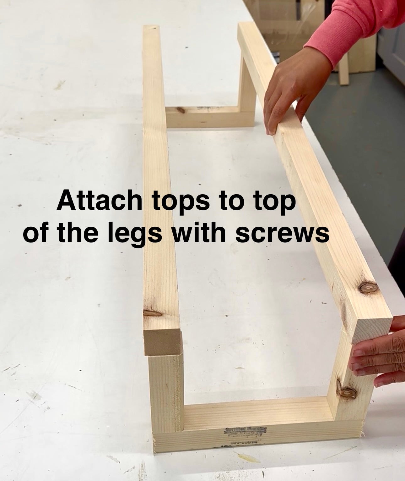Attaching the long shoe supports to the 2x2 shoe rack legs