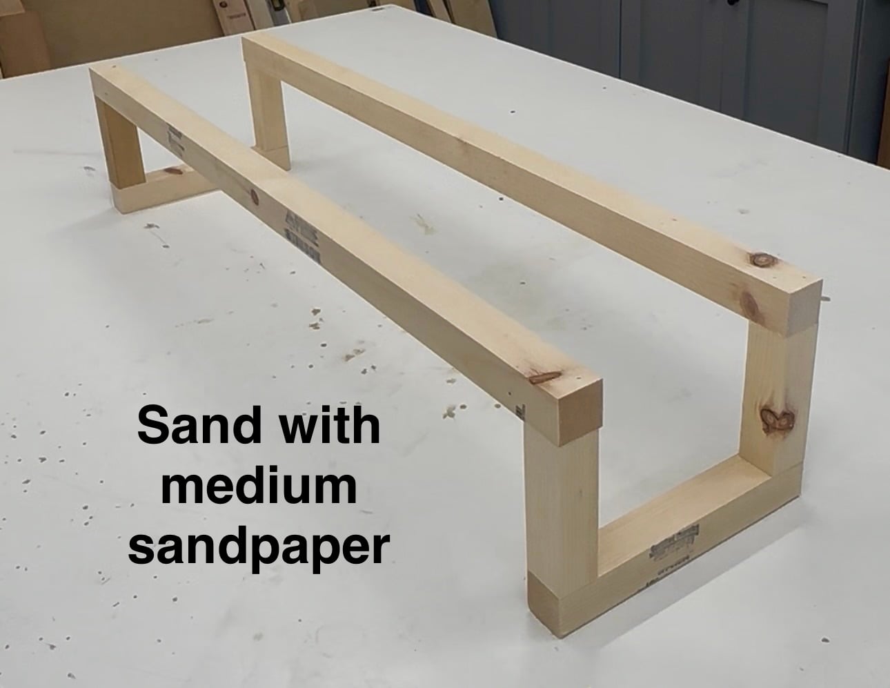 Completed unfinished DIY shoe rack made from 2x2 lumber